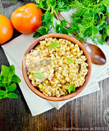 Image of Barley porridge with basil on napkin top