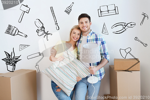 Image of happy couple with stuff moving to new home