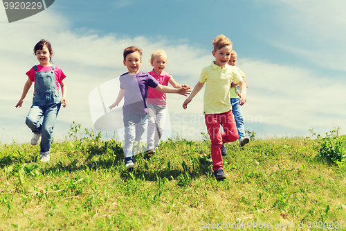 Image of group of happy kids running outdoors