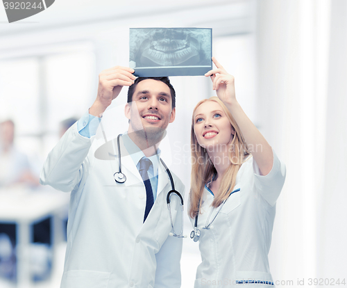 Image of two doctors looking at x-ray