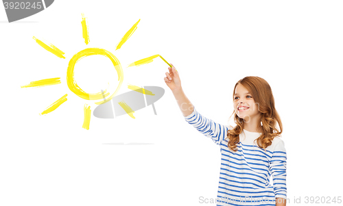 Image of girl drawing big sun in the air