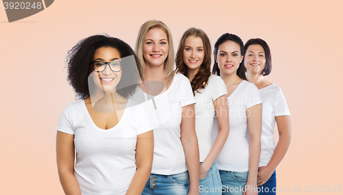 Image of group of happy different women in white t-shirts