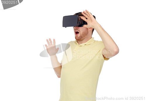Image of happy man in virtual reality headset or 3d glasses