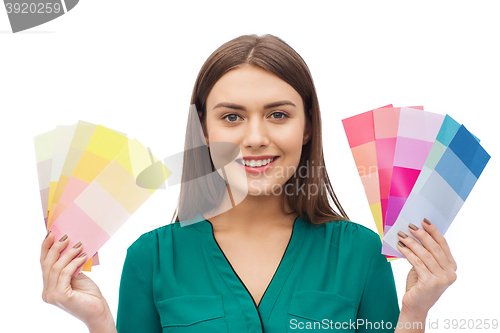 Image of smiling young woman with color swatches