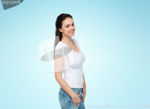 Image of happy young woman or teenage girl in white t-shirt