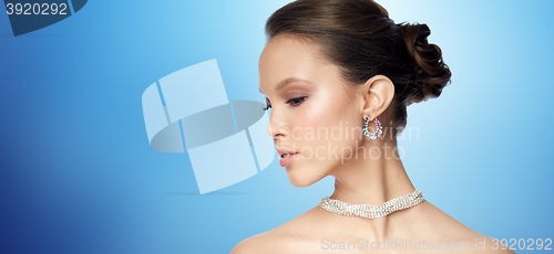 Image of close up of beautiful woman face with earring