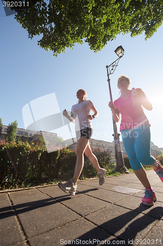 Image of female friends jogging