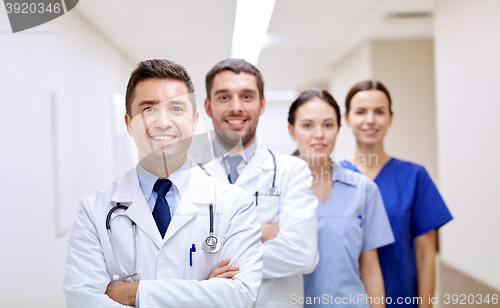 Image of group of happy medics or doctors at hospital
