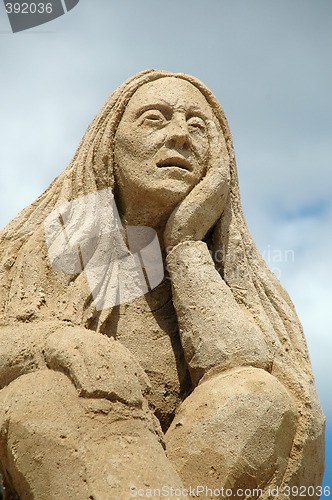 Image of Sad sand woman