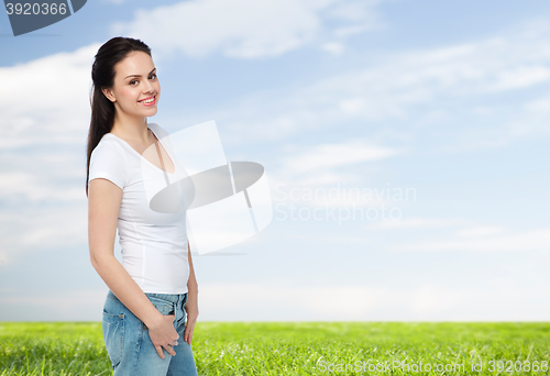 Image of happy young woman or teenage girl in white t-shirt