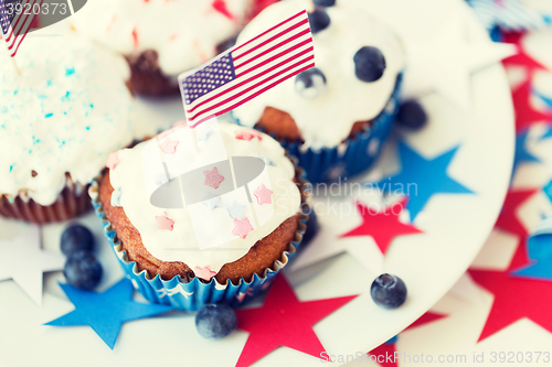 Image of cupcakes with american flags on independence day
