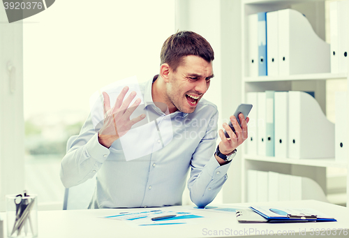 Image of close up of businessman with smartphone