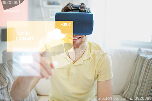 Image of young man in virtual reality headset or 3d glasses