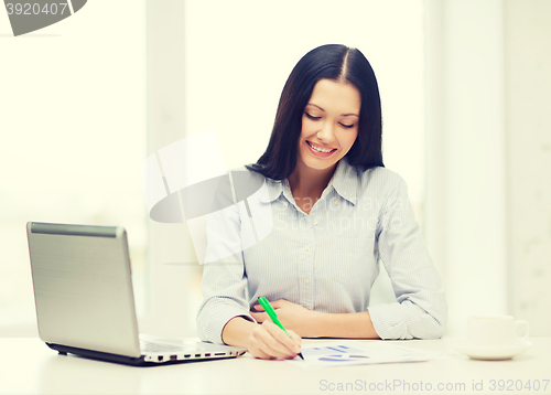 Image of smiling businesswoman or student with laptop