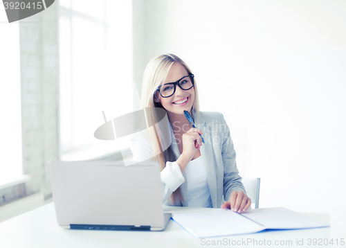 Image of businesswoman with documents