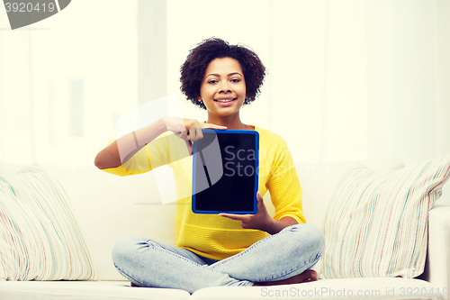 Image of happy african american woman with tablet pc