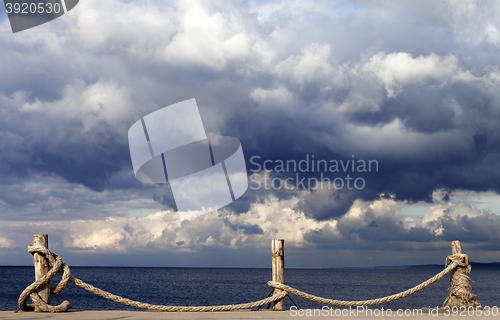 Image of Seafront and cloudy storm sky in autumn