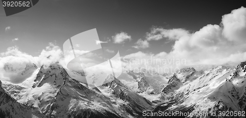 Image of Black and white panorama of sunlight mountains in cloud