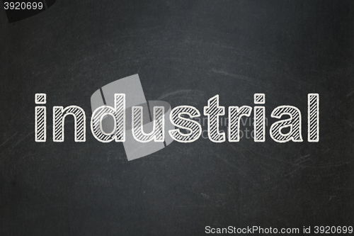 Image of Manufacuring concept: Industrial on chalkboard background