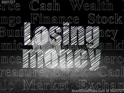 Image of Money concept: Losing Money in grunge dark room