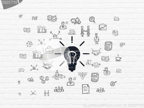Image of Business concept: Light Bulb on wall background