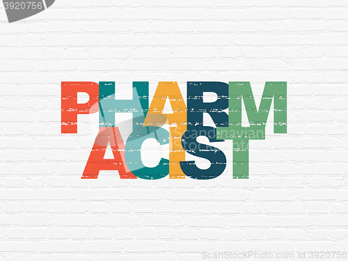 Image of Medicine concept: Pharmacist on wall background