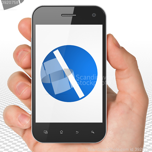 Image of Medicine concept: Hand Holding Smartphone with Pill on display