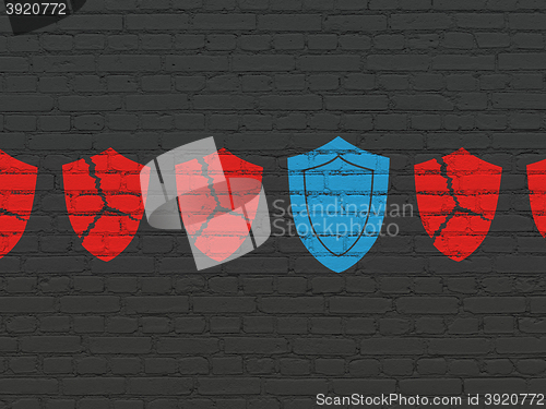 Image of Safety concept: shield icon on wall background
