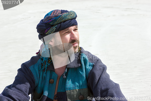 Image of Portrait of a man in his turban against the backdrop of the dese