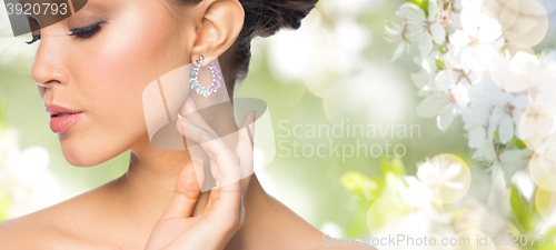 Image of close up of beautiful woman face with earring