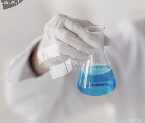 Image of close up of hand with flask 