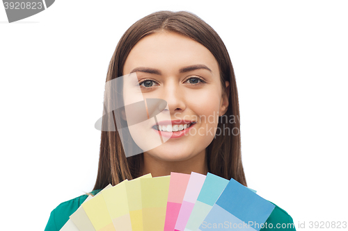 Image of smiling young woman with color swatches