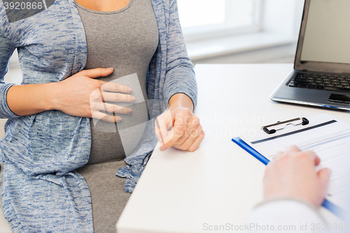 Image of close up of doctor and pregnant woman at hospital