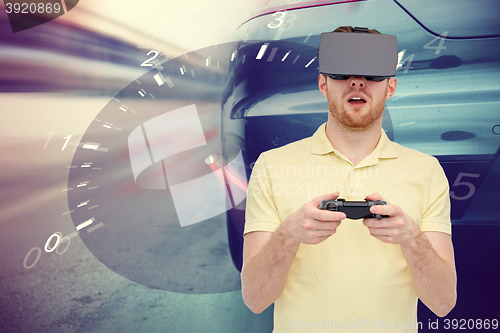 Image of man in virtual reality headset and car racing game