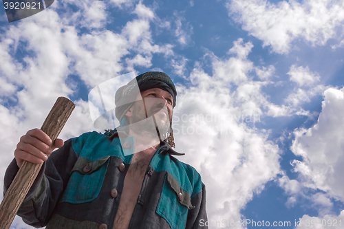 Image of Man in his turban under a blue cloudy sky