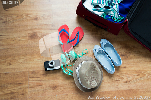 Image of close up of travel bag with clothes and stuff