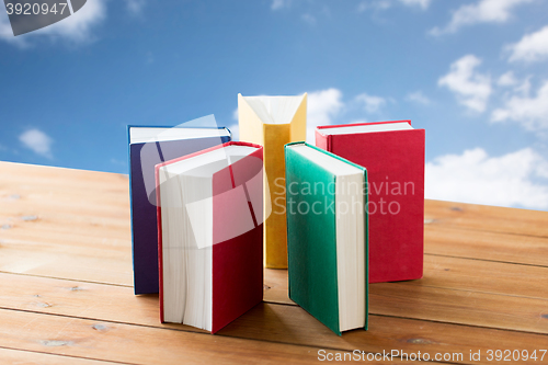 Image of close up of books on wooden table