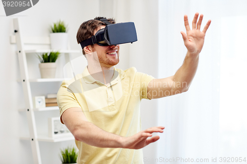 Image of young man in virtual reality headset or 3d glasses