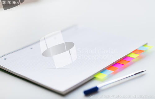 Image of close up of organizer and pen on office table