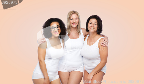 Image of group of happy plus size women in white underwear