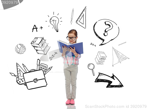 Image of happy little girl in eyeglasses reading book