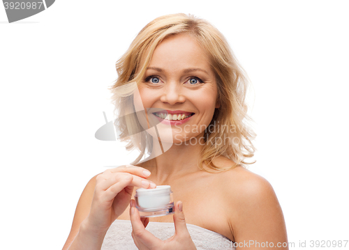 Image of happy woman with cream jar