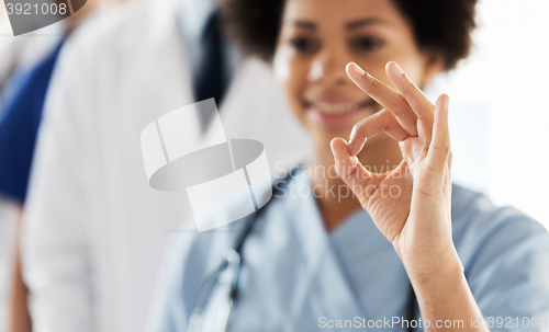 Image of close up of doctor or nurse showing ok sign