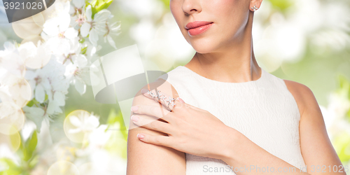 Image of close up of beautiful woman with ring and earring