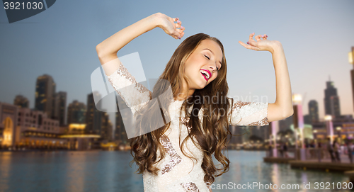 Image of happy young woman or teen girl in fancy dress