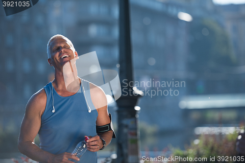 Image of portrait of handsome senior jogging man