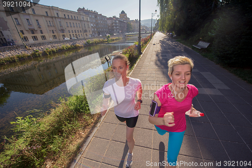 Image of female friends jogging