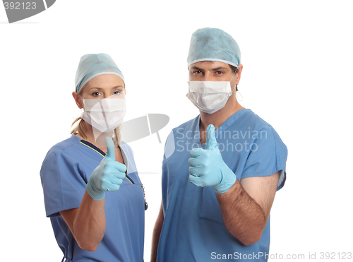 Image of Two surgeons success thumbs up