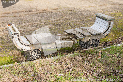 Image of Old ruined with time outdoor bench