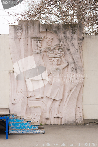 Image of Vityazevo, Russia - March 14, 2016: bas-relief depicting two girls with grapes in hands of the House of Culture in the resort village Vityazevo, a suburb of Anapa